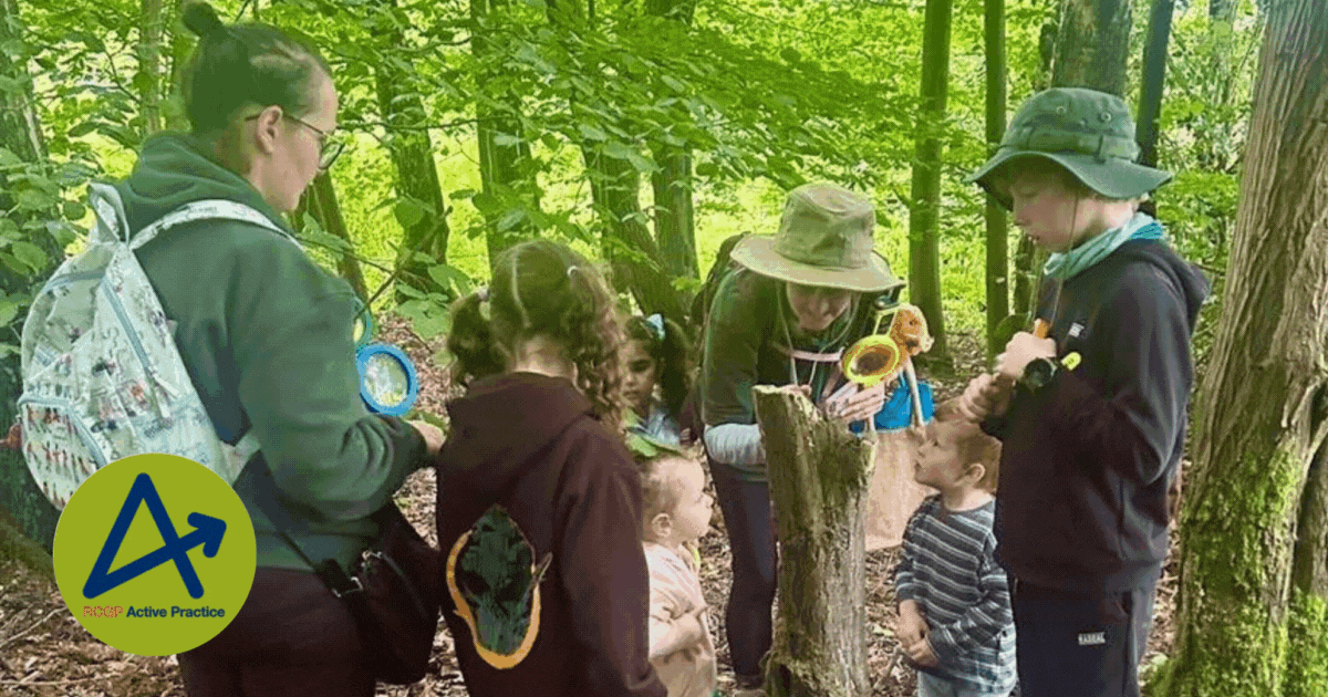 a young family in the woods exploring