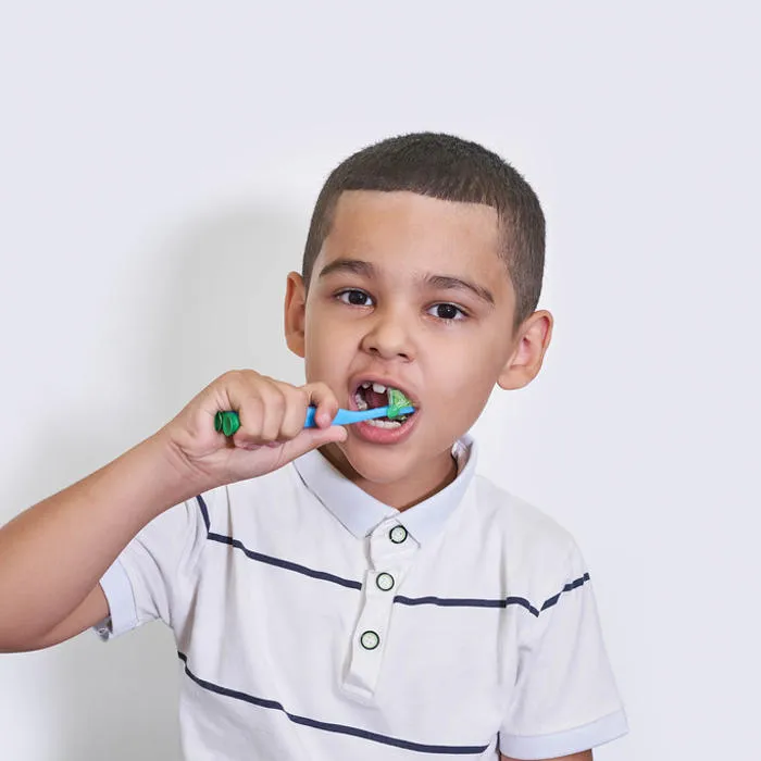 7-8-years-old-kid-boy-in-white-shirt-brush-his-teeth-with-toothbrush