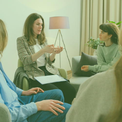 Woman talking to a group of people