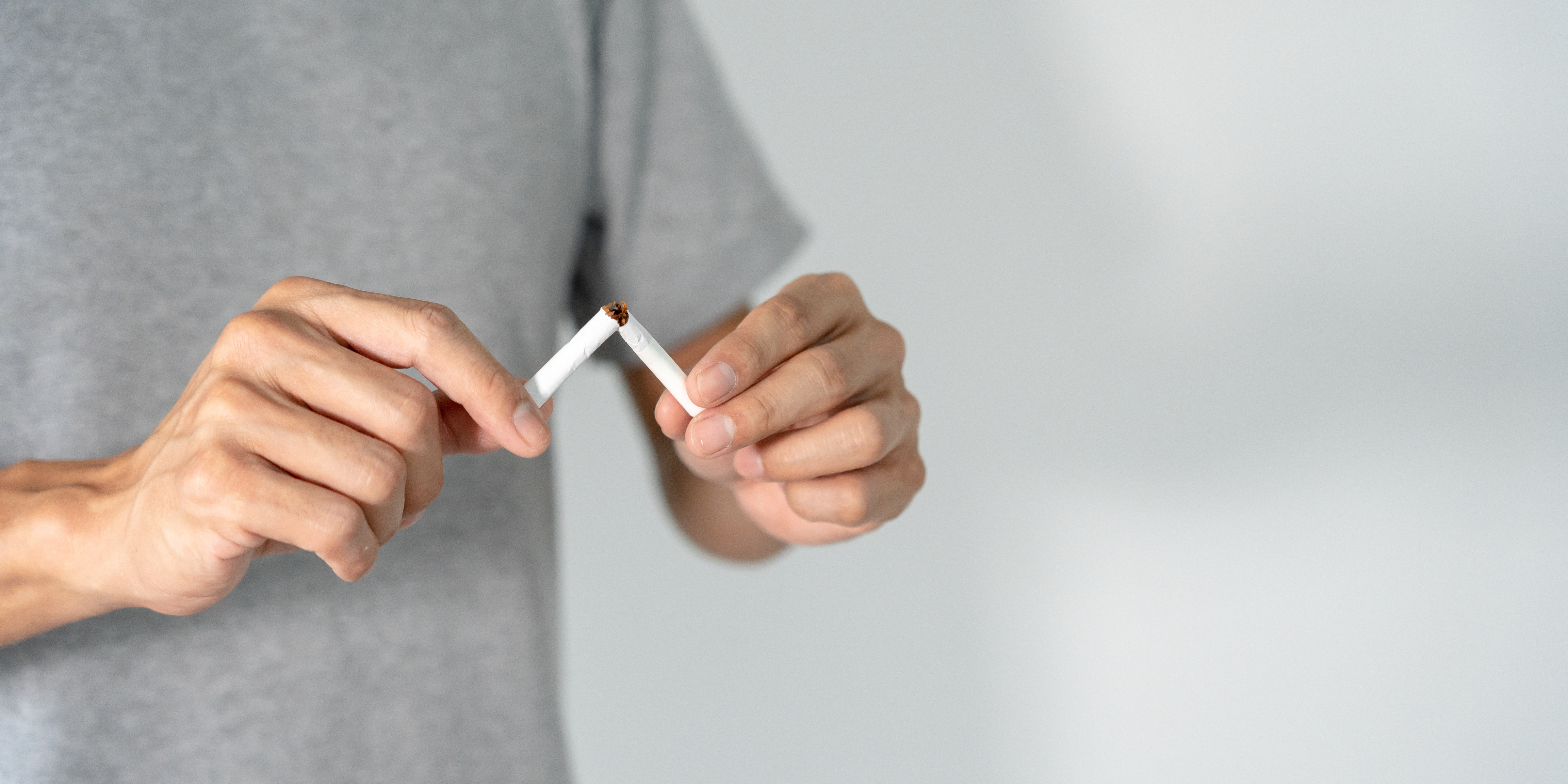A person snapping a cigarette