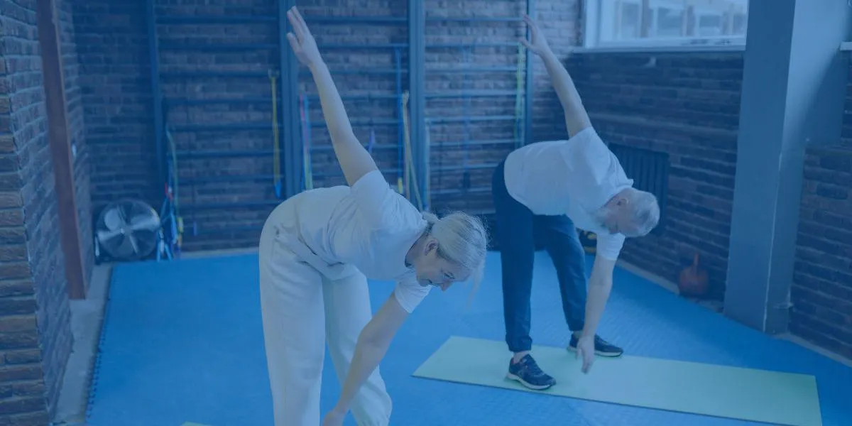 a man and a woman exercising on yoga mats
